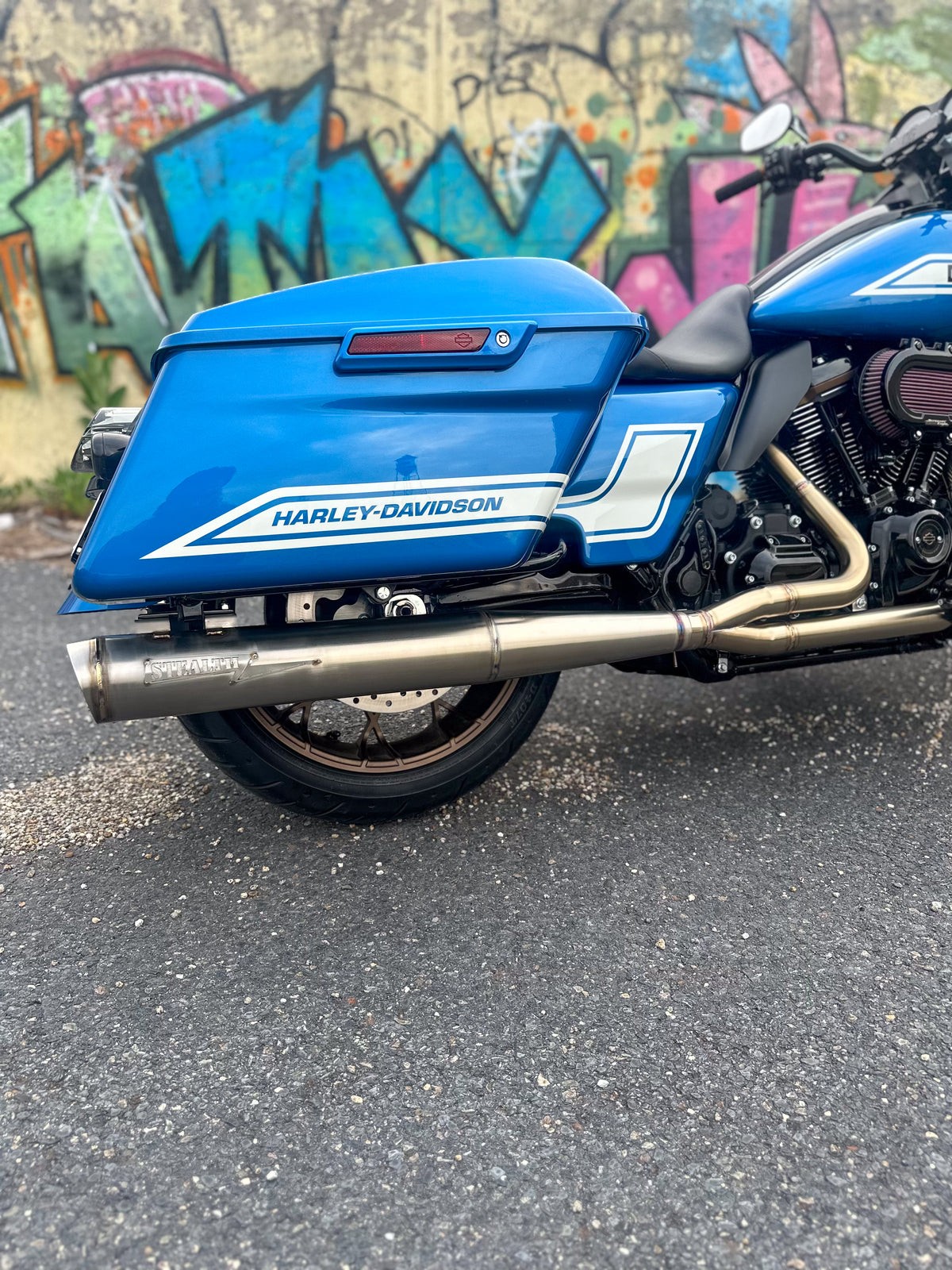Harley bagger motorcycle with Stealth Pipes full length muffler installed – American-made stainless exhaust upgrade, photo 1 of 10