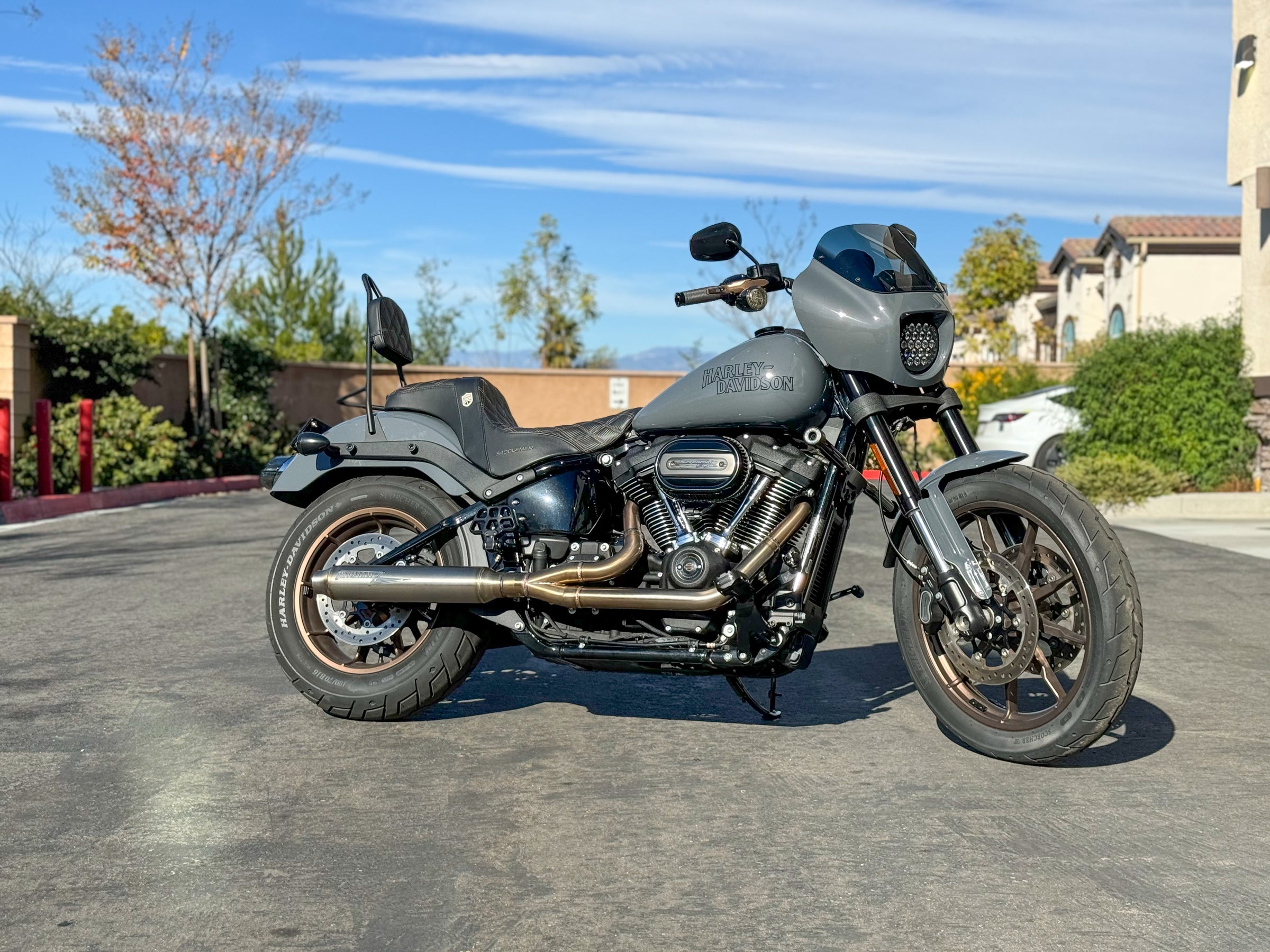 Stealth Pipes exhaust system installed on Harley M8 Softail – rear-side view of muffler and headers (2017–2025)