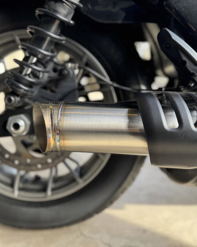Slip-on muffler exhaust system for a Harley Davidson Nightster, made of stainless steel, installed on a motorcycle